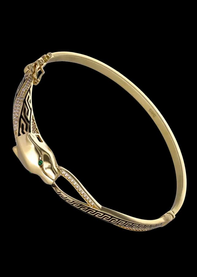 Bracciale rigido con testa di pantera dorata, occhi verdi, diamanti e smalto